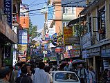 Kathmandu 02 01 Thamel Busy Street After I arrive in Kathmandu, I head to the busy streets of Thamel. Thamel has many book shops, souvenir shops, trekking gear shops, trekking agencies, low and medium-priced hotels, and restaurants. Thamel is busy both day and night.